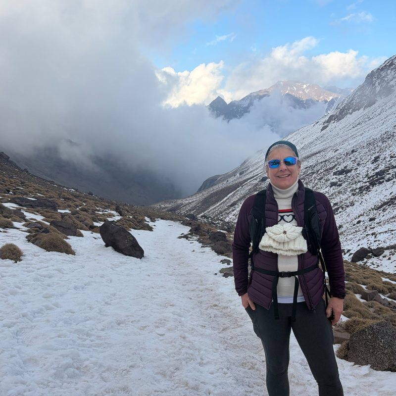 Vicky hiking on a snow-covered mountain path